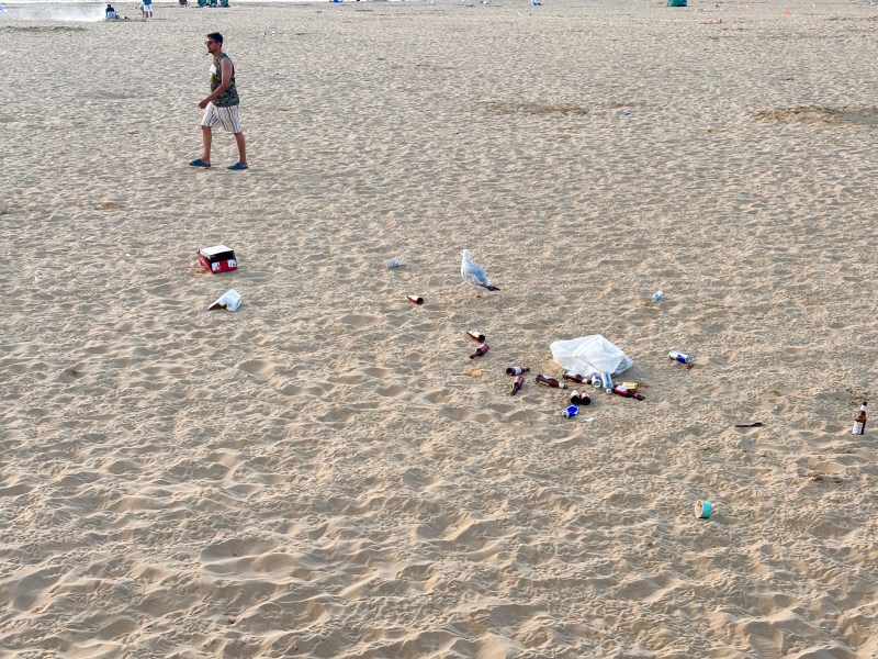 Rubbish littered on the sand at a beach