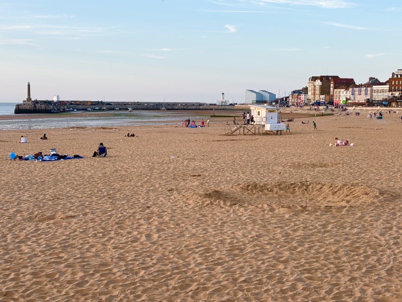 Beach at dusk featuring the shore and lifeguard hut